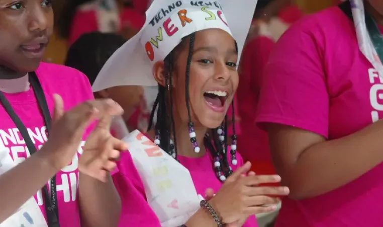 Nilsa Gomes, 10, of Brockton, sings the Power Scholars Song with the rest of her fellow graduates at the Baker School on Wednesday, July 30, 2025. Mark Jarret Chavous/The Enterprise