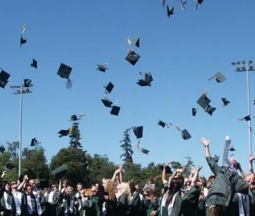 Graduation hats in air