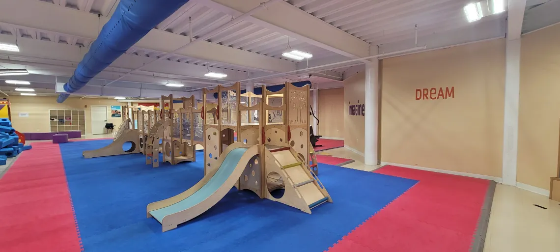 Play Space room full of wooden structures and toys for kids in Stoughton